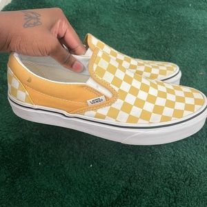 Vans slip on checkerboard shoes in golden yellow